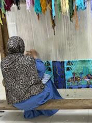 Woman Working on Carpet at Akhnaton Carpet School in Giza, Egypt (Dr. Brenda M. Greene)
