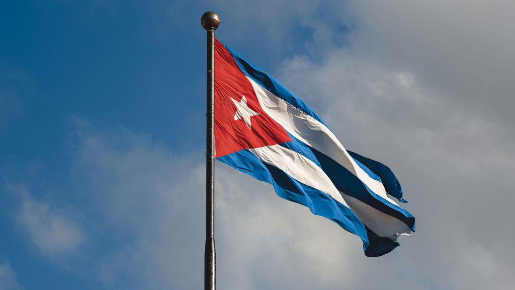 Cuban flag flying against the sky.