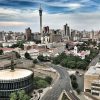 Skyline of Johannesburg, South Africa, viewed from above with city buildings and roads.