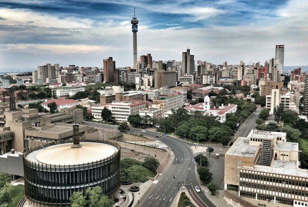 Skyline of Johannesburg, South Africa, viewed from above with city buildings and roads.