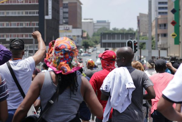 Protesters marching through a street in Johannesburg, South Africa