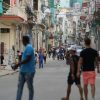 Residents walking along a street in Havana, Cuba.